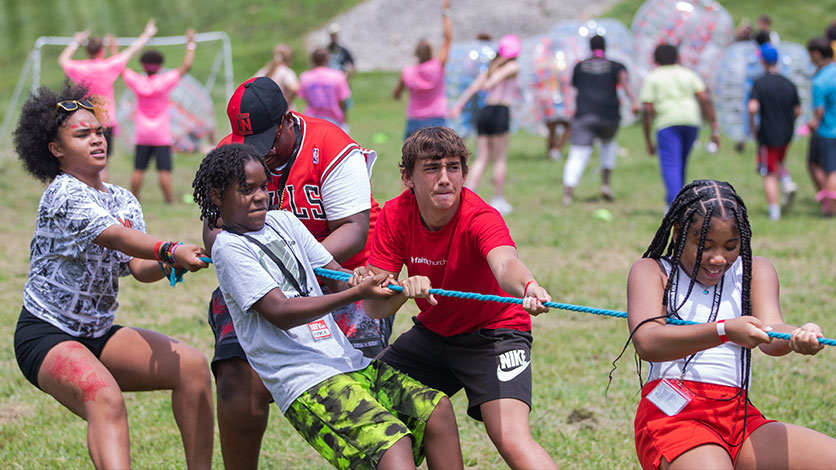 Students at REVCon concert with glow sticks