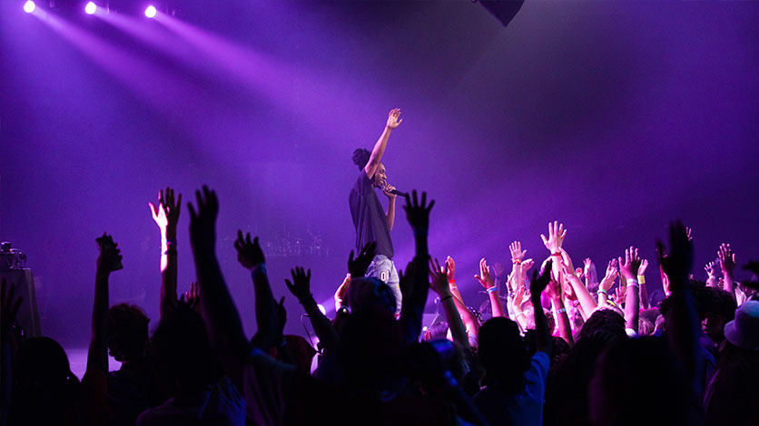 Worship session — hands raised